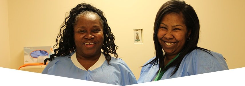 Two smiling nurses